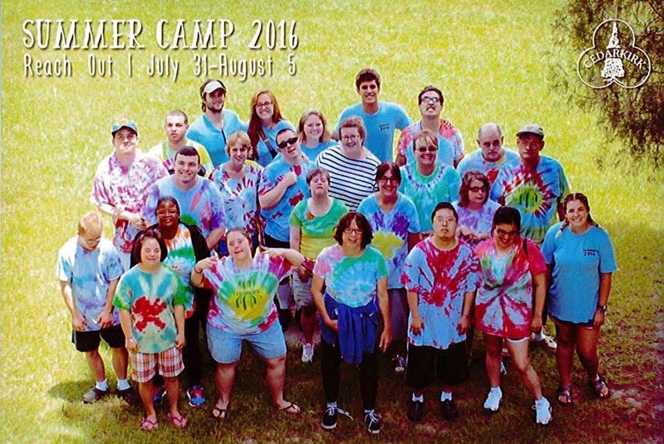 McClain INC residents and staff at Camp CedarKirk wearing tie-dye shirts